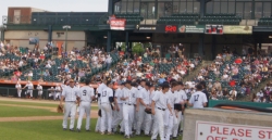 Cats players head into their dugout after an inning. 