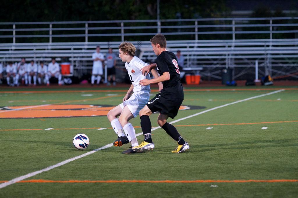 Junior Alex Stiber wins the ball from Antioch. 