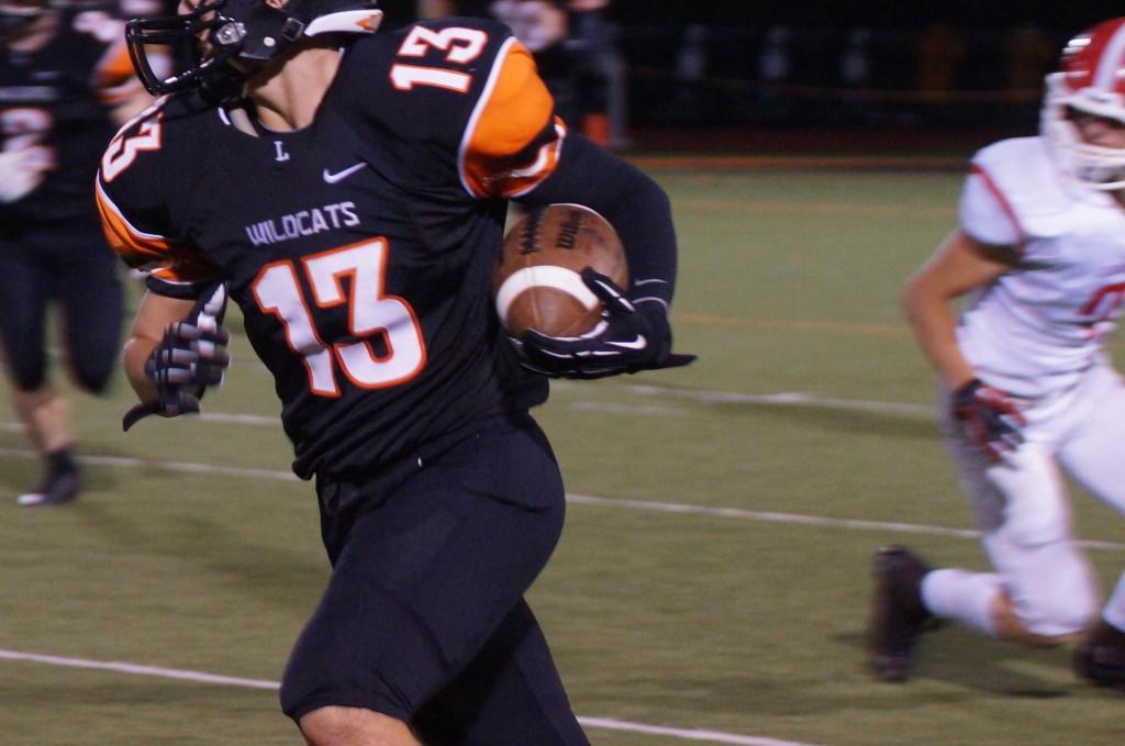 Junior receiver Jake Mansfield catches a pass and turns it upfield. 
