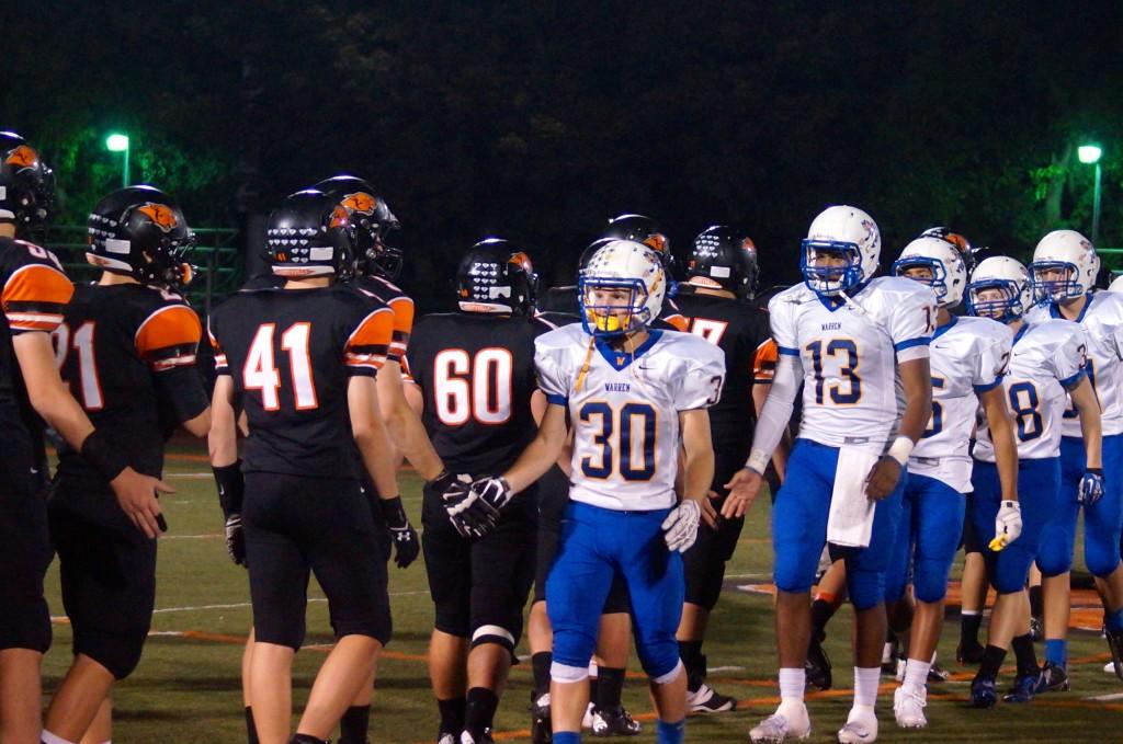 The Cats line up and shake hands after a tough Homecoming defeat.