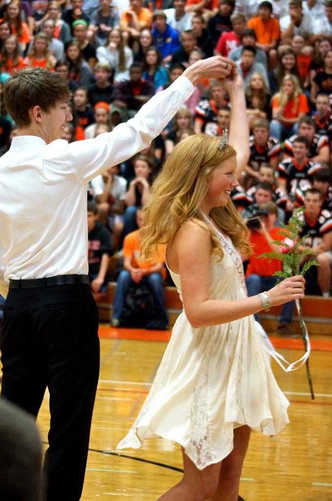 Jack Baumruk escorts Abbie Anderson to the Sweet 16 stage.