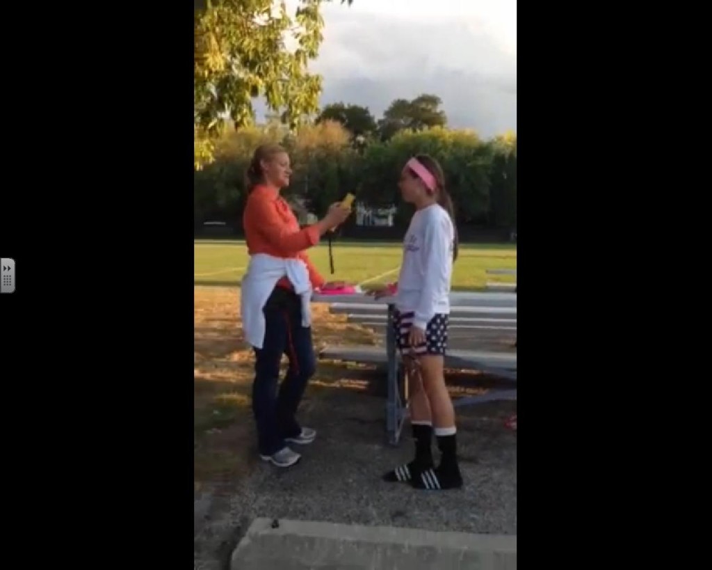 LHS Team Leader Sara Rogers uses the alcohol wand on an LHS senior at a recent tailgate.