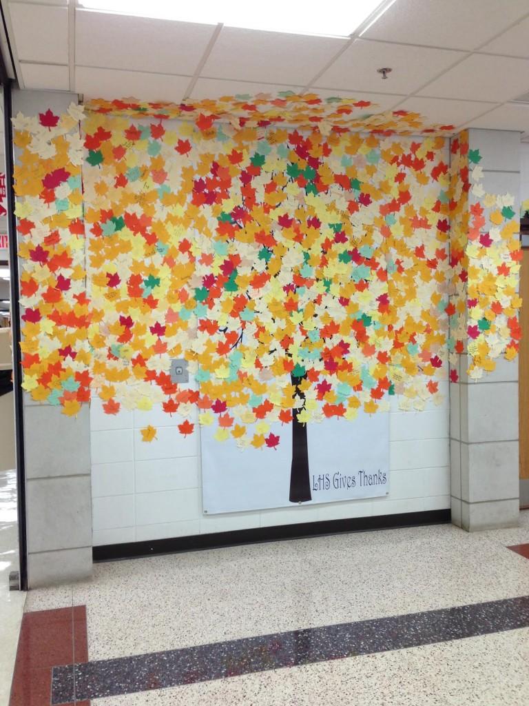 More than 2,000 leaves set upon the wall next to the security desk.
