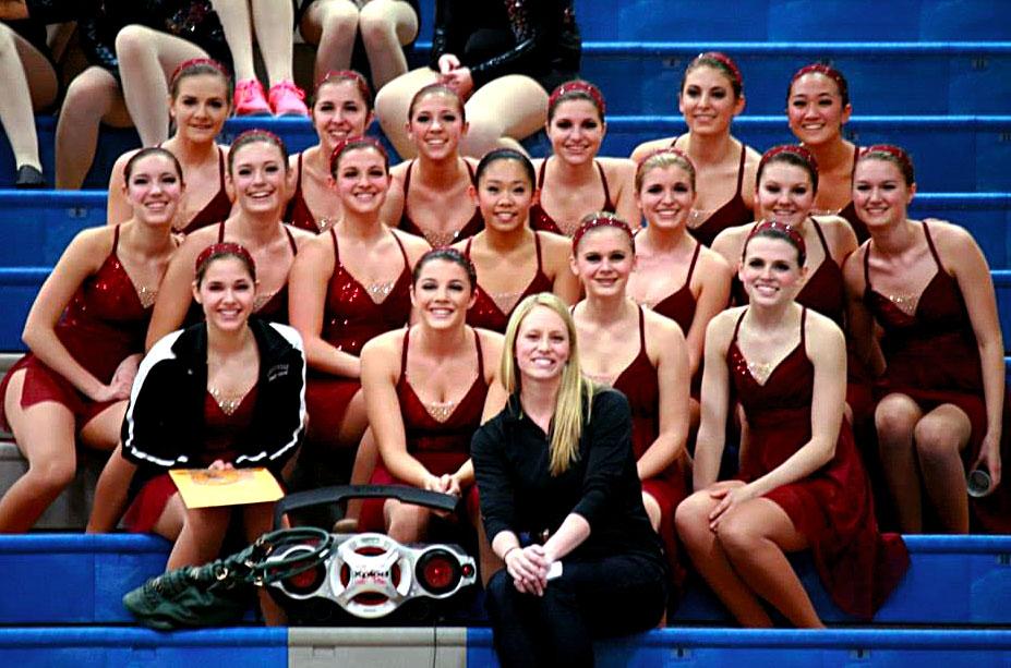 The+LHS+varsity+poms+team+poses+with+their+coach+during+their+competition.+