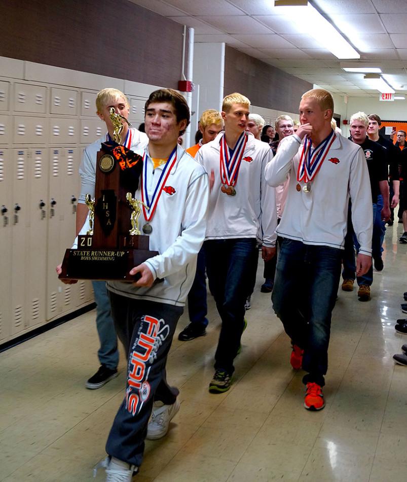 Patrick Birck carries the trophy