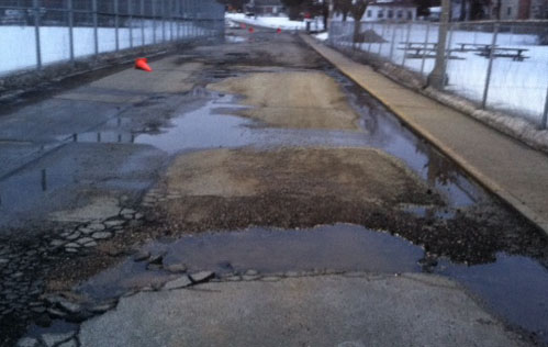 The potholes by the tennis courts have been causing trouble fir students trying to drive around the school.