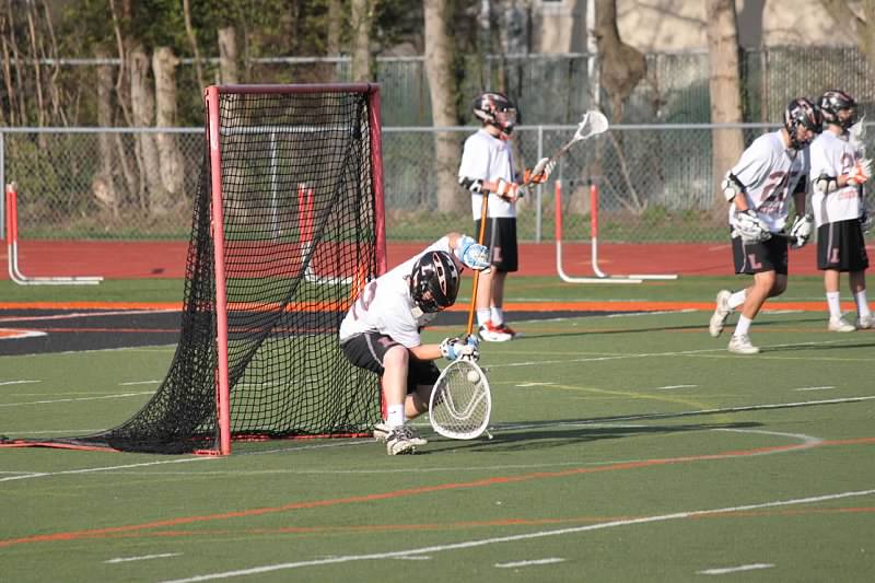 LHS goalie Cole Blazer makes a save against Lake Forest in 2013.