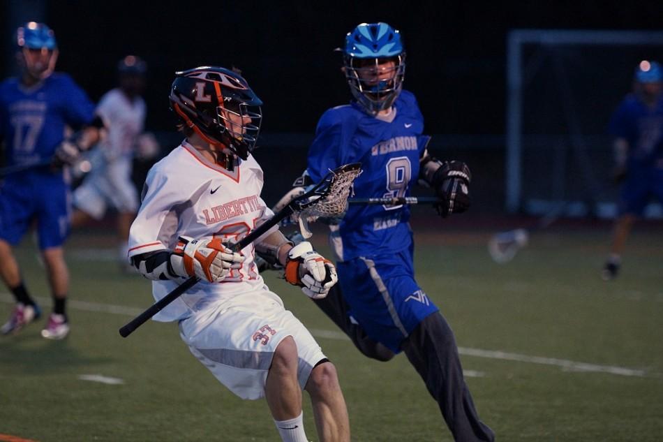 Junior Dan Schilling recieves the ball and keeps it away from Vernon Hills. 