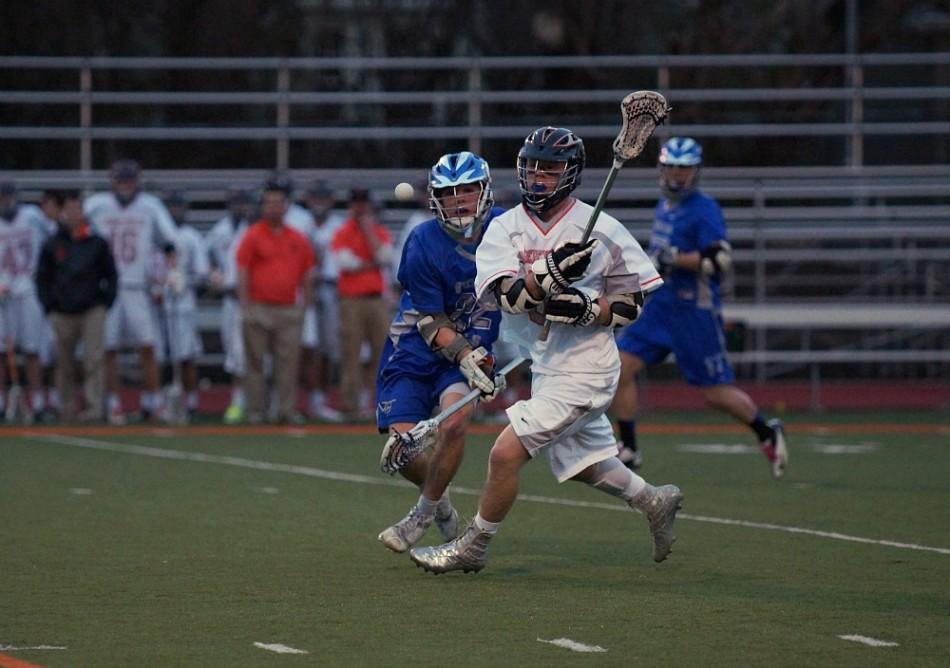 Junior Connor Cleary fights for the ball against a Vernon Hills player. 