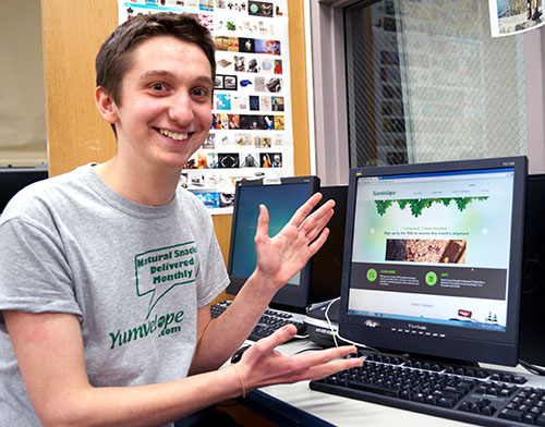 Proud owner Sam Gold, clad in his Yumvelope attire, shows off his company.