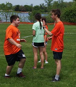 Junior Chris Derose and senior Trevor Fuhrman supporting each other with high fives.