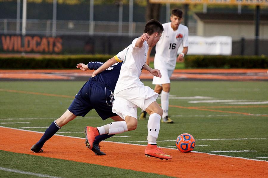 Trey Toohey gets the ball from Evanston and dribbles towards goal during the game against Evanston on August 27. The team won, bringing in a 2-1 victory.