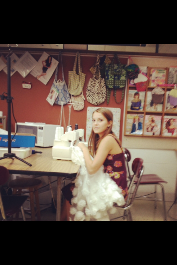 Sammie Mackey working hard at her sewing machine as she puts the finishing touches on her homecoming dress.