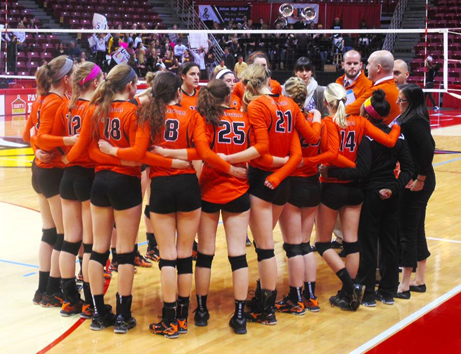 Coach Loika talks to his team during a timeout against Loyola Academy in the State Semifinal game 