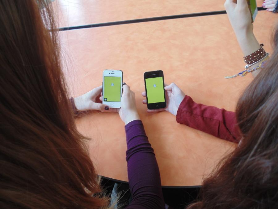 LHS students spend their time sending Snapchats to their friends during 4th period lunch. Even though these students are not old enough to use Snapcash, they enjoy using Snapchat to send photos and videos.