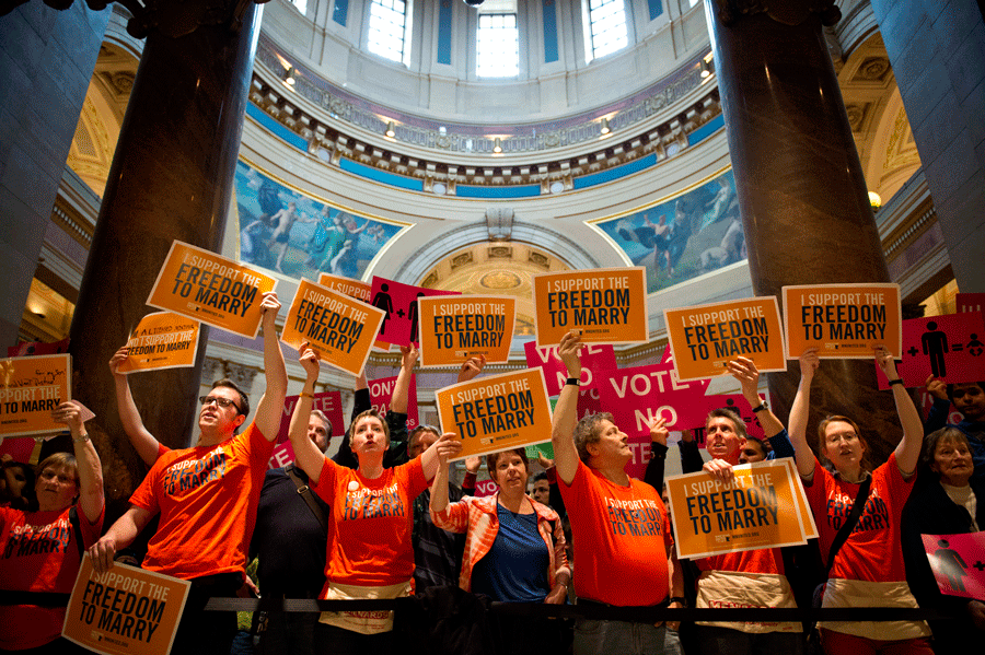 Advocates+for+both+sides+of+allowing+same-sex+marriage+protest+in+the+entrance+to+the+House+floor+at+the+Minnesoate+state+Capitol+in+2013.+The+court+decision+will+take+place+in+the+spring+of+2015.