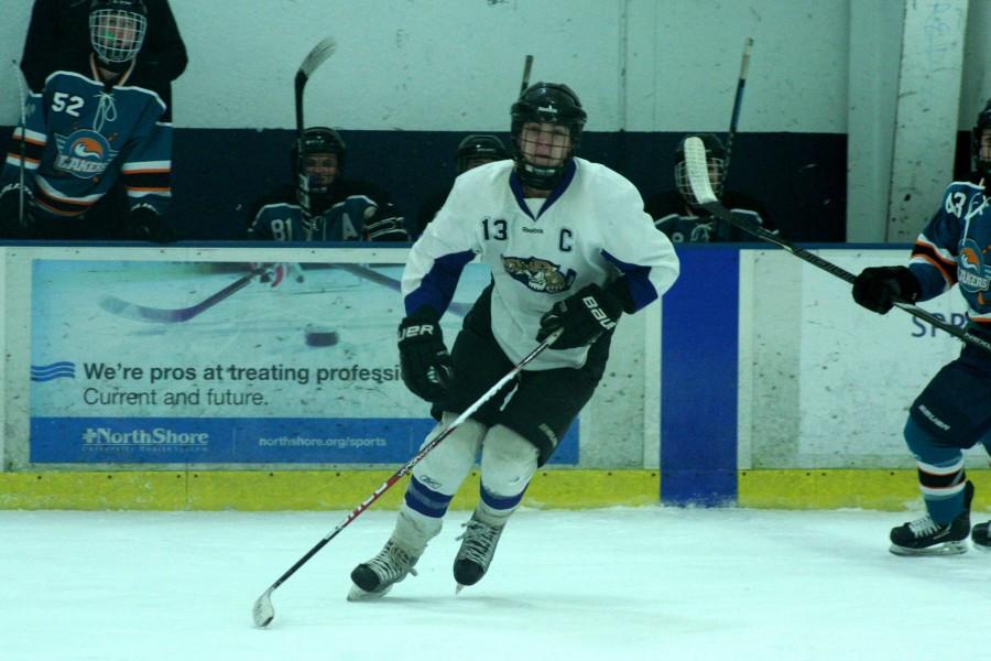 Alex Feinman, one of the Varsity IceCats' leading scorers, skates into play.
