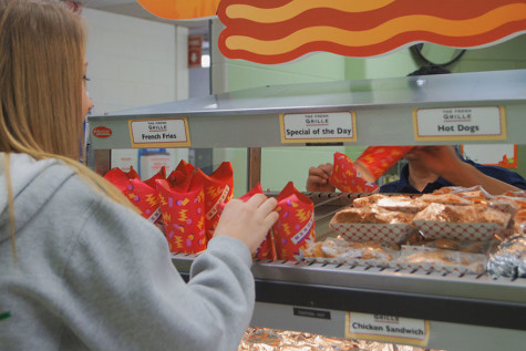 Students line up in the cafeteria to purchase the new fries. 