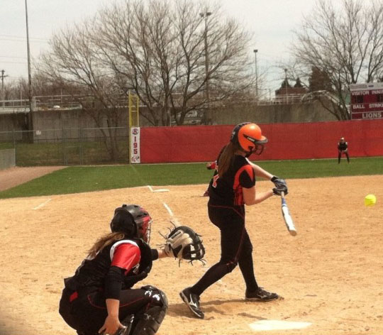 Junior McKenzie Jordan is about to run the bases during a softball game after hitting a high velocity ball headed her way.