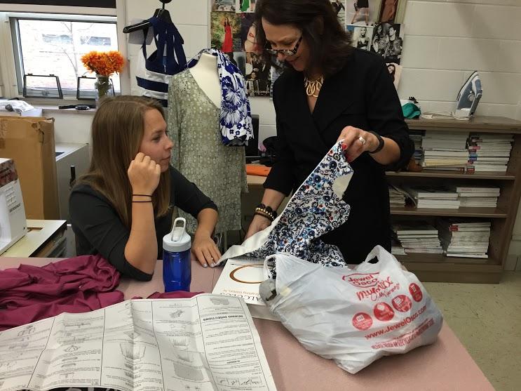 Mrs.+Patterson+helps+Anna+Mackey+with+a+sewing+project.++
