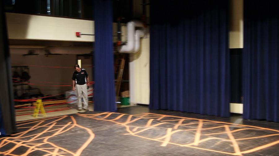 Security guard Mike Dolan acknowledges the ruined theater floor