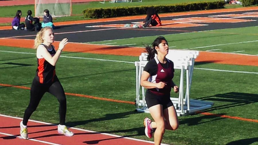 Me running in my last home meet of senior year in the 800 meter race.