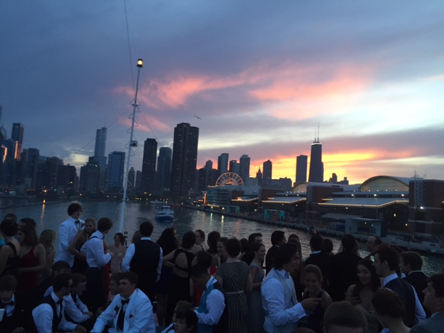 Prom goers socialize on the boat deck. 