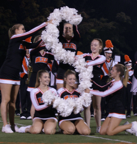 The varsity poms team finished their halftime routine by spelling out LHS.