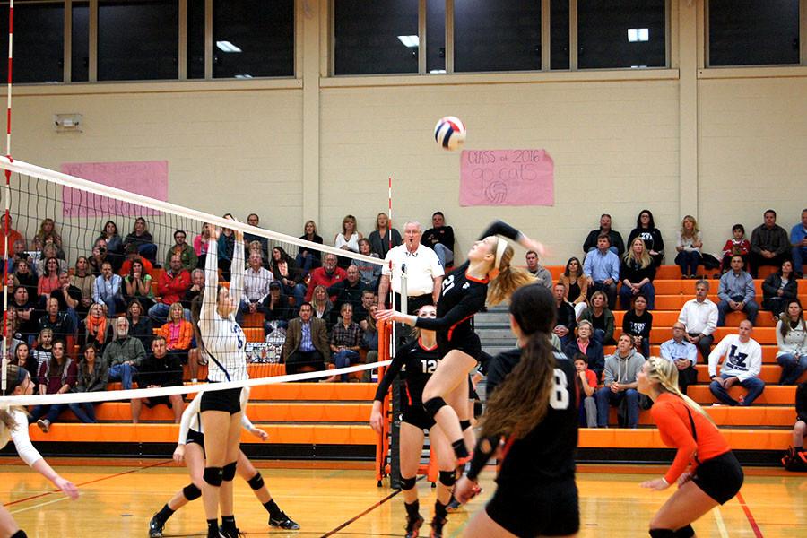 Senior Hannah Zerwas skies high for a kill in Wednesday's division-winning game.