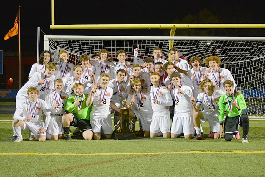 The+Wildcats+celebrate+their+first+ISHA+Class+3A+state+championship+title+after+defeating+Quincy+2-1.