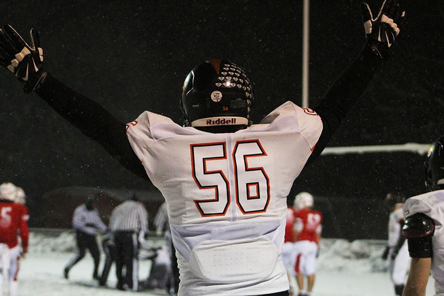 Junior defensive lineman Ryan OMalley celebrates a late safety forced by the Wildcat defense. 