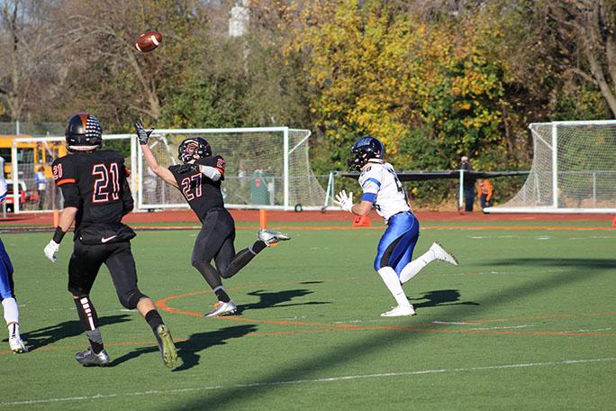 Wide receiver Timmy Calamari(6 rec, 193 yards, 2 TD's) extends for a one-handed catch during the Cats 27-17 victory over Lincoln-Way East.
