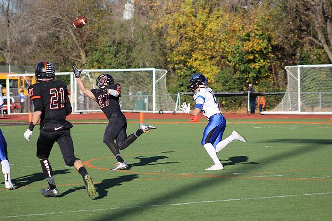 Wide receiver Timmy Calamari(6 rec, 193 yards, 2 TDs) extends for a one-handed catch during the Cats 27-17 victory over Lincoln-Way East.