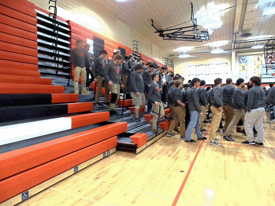 The players and coaches were surrounded by parents, fans, cheerleaders, dance team members, and administration members in their 2015 state sendoff.