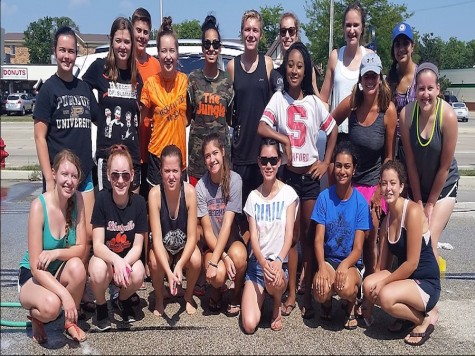 Picture at car wash: The club Interact raise money by having a car wash at ACE hardware.