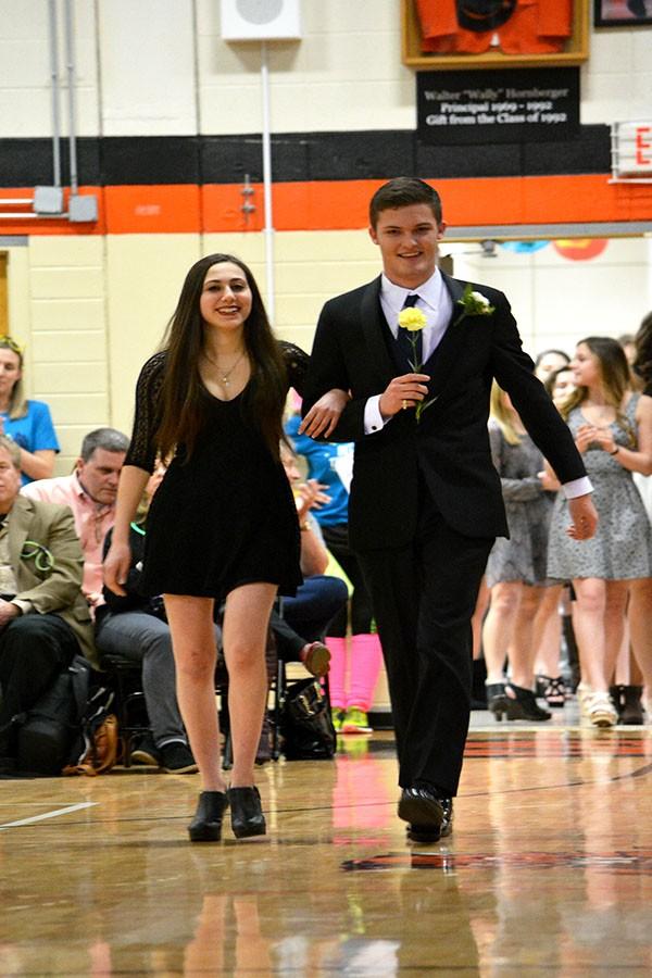 Select 16 member William Engfer and his Honor Escort Jackie Ovassapian enter the main gym during the Turnabout assembly.