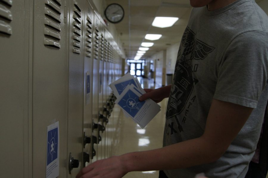 Bridge club and Best Buddies members put blue slips on lockers for Autism Awareness Month.