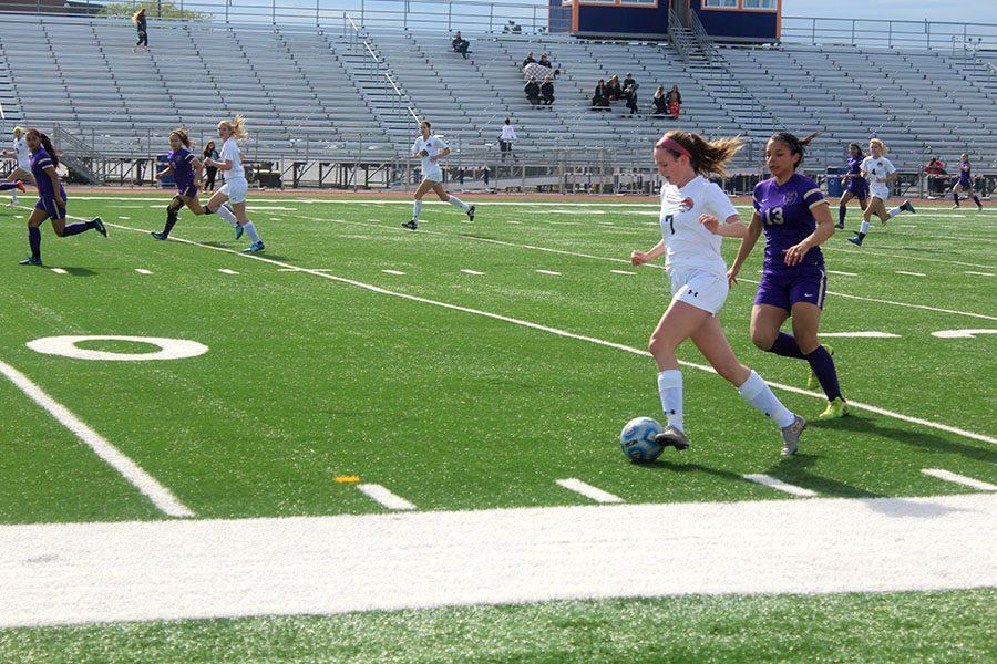 Sophomore Makenna Yoor sprints past a Waukegan defender in Tuesday's playoff opener.