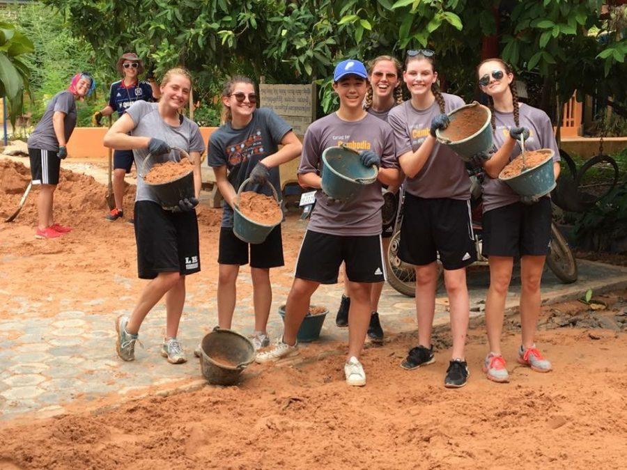 Students worked on sanding, paving, and tiling roads at schools in Siem Reap.