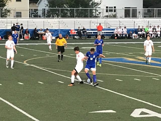 Austin Becker tries to win the ball from a Lake Zurich defender in the 2nd half of Tuesdays regional.