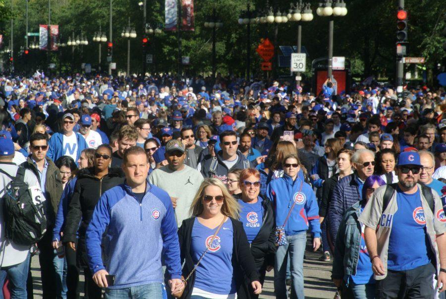 A sea of people close down multiple streets in Chicago as they jovially stroll through them in honor of the Cub’s World Series win and in purpose of walking to a parade viewing-spot.