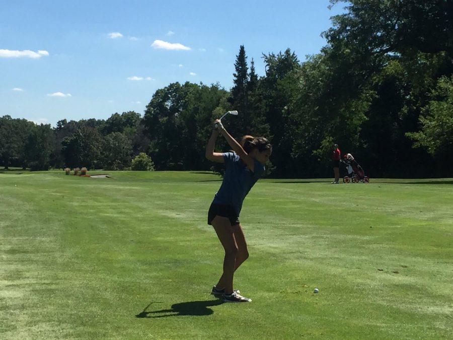 During a match this season, Mikaelian attempts a shot on the fairway. 