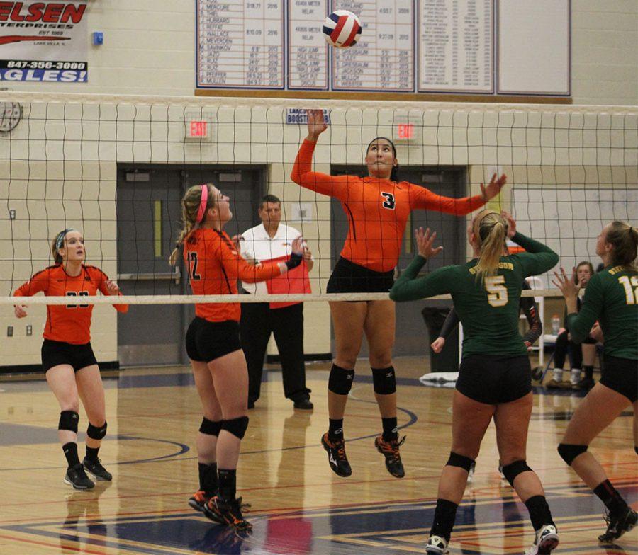 Haley Stevenson spikes it for the point against Stevenson High School.