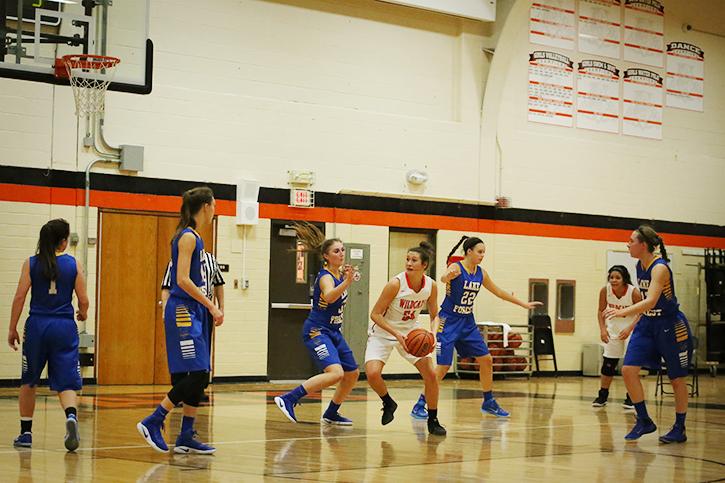 Senior and team captain Claire Keefe attempts to push through the Lake Forest defense.