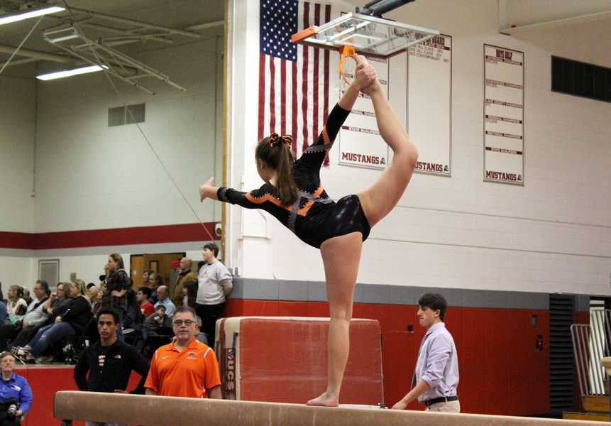 Anna Carlson scores a 6.8 on beam. Carlson also competed on bars, floor, and vault.