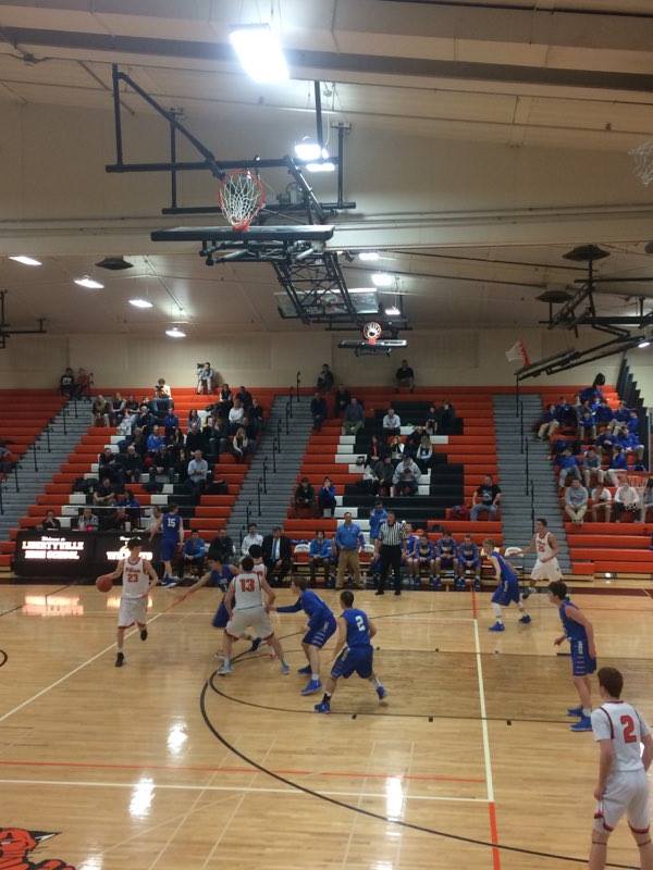 Wildcats player Drew Peterson fights to make his way down the court.