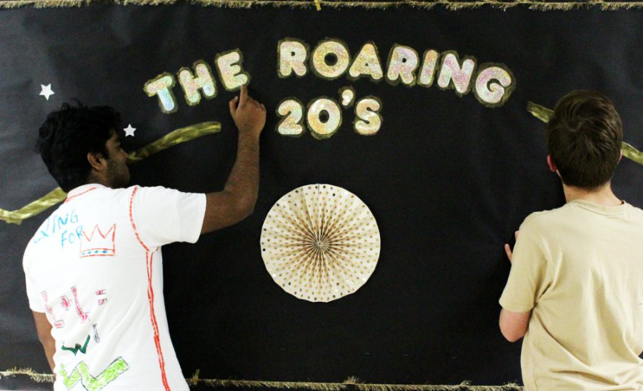 The title of this year’s Turnabout theme, “The Roaring 20’s,” is featured right across from the cafeteria entrance in bright gold.