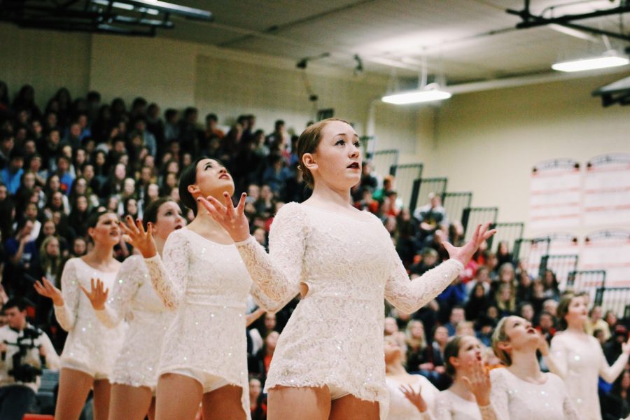 Varsity poms dancers perform a dance routine to the song “Hallelujah.” Junior Megan Wolter is pictured in the front. 