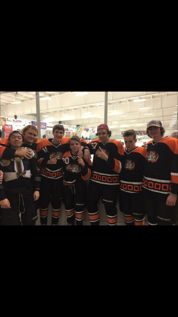 IceCats players (in left to right order) Agemura, Blacker, Cox, Darnall, Glynn, King, and Schweiger pose for a picture at Glacier Ice Arena.
