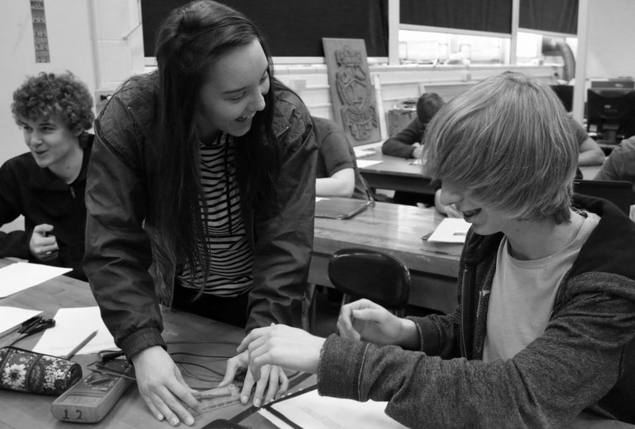 Two LHS students,  junior Christina Simley and sophomore Trinity Hudson, from the electronics class located in room 002 taught by Mr. Thomson, work on an in-class lab on parallel circuits. 